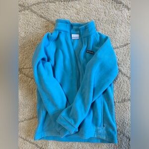 Woman’s bright blue Columbia jacket
